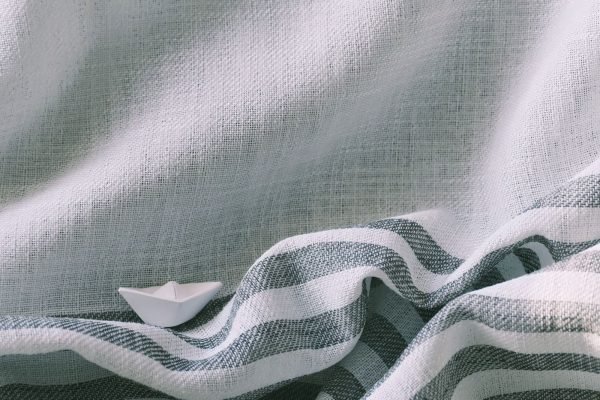 The slim striped border, woven in