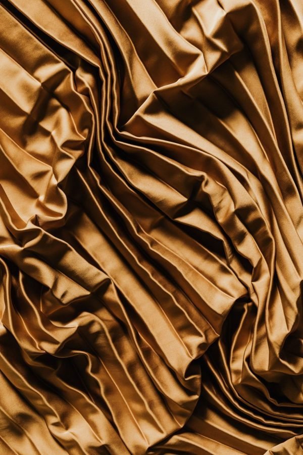 Katan silk in gold, showing the crisp drape