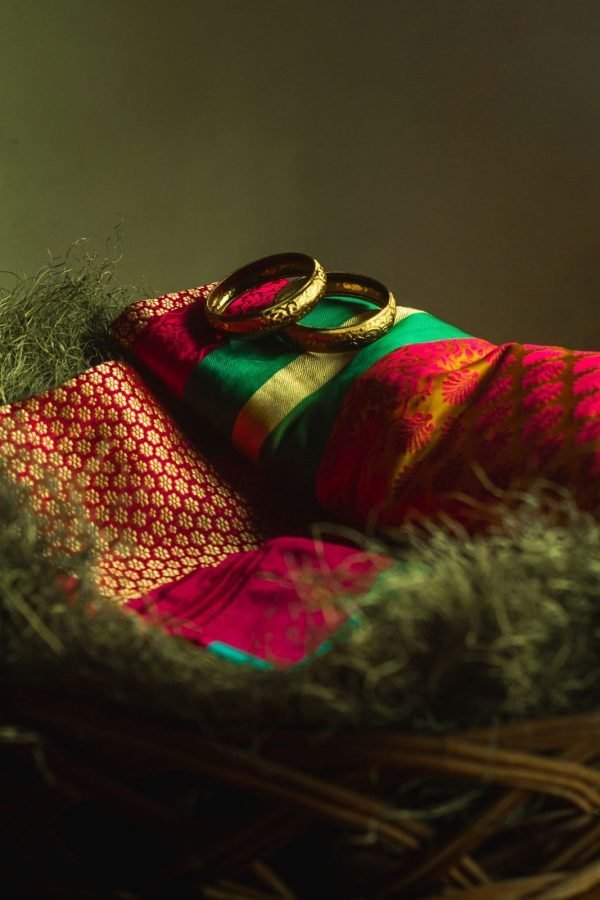Folded madder-red silk with gold zari