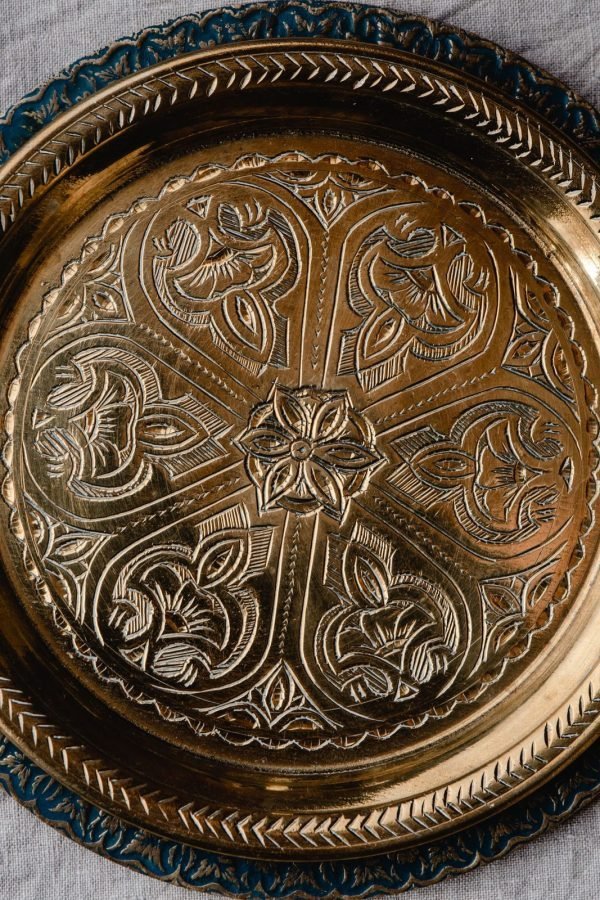 Dokra brass serving tray with tribal motif border