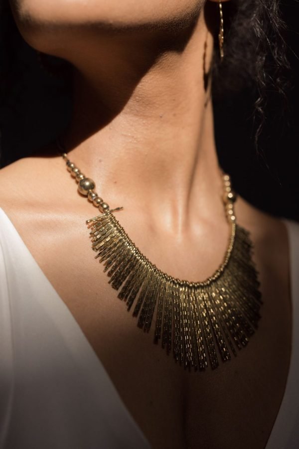 Adira Dokra brass choker worn close to the throat