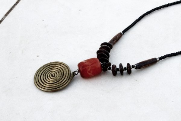 Cast brass on its adjustable cotton cord